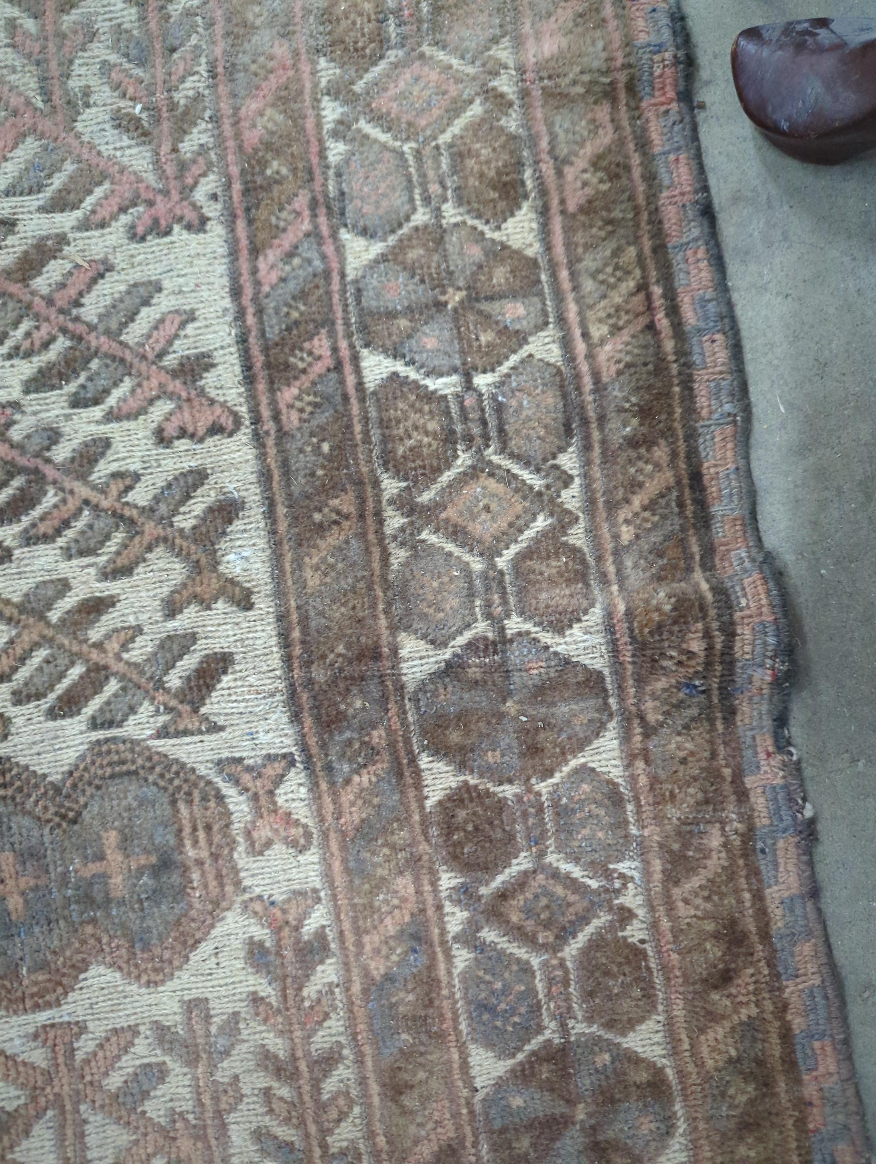 An ivory ground Afghan runner, 370 x 93cm